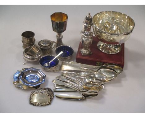 A collection of silver including flatware, napkin rings, decanter lables, two pepperettes, a mustard, three salts, an ashtray