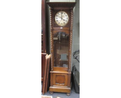 An 8 day oak longcase clock with barley twist column supports on paw feet 201cm high  