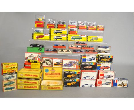 An interesting selection of boxed metal and plastic miniature vehicles and miniature kits in  various different scales by Sch