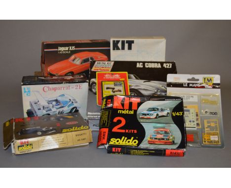 Eight metal model kits, all cars, by Solido, IMC and others. Contents not checked.