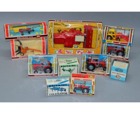 A good quantity of vintage boxed Britains agricultural vehicles and farm implements including a 9570 MF Combine Harvester. an