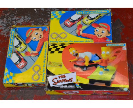 Three boxed Scalextric Slot Car Sets, including two 'My First Scalextric' 1:64 sets together with a boxed  Simpsons Skateboar