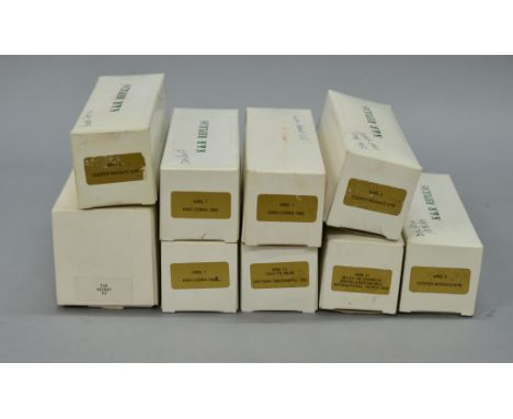 Nine boxed  white metal model car kits  in 1:43 scale branded 'K & R Replicas Racing Line' (UK). Contents not checked.. (9)