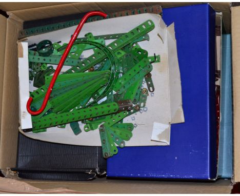 A very good quantity of vintage loose Meccano parts, contained in four boxes, including  wheels, fixings, straight and curved