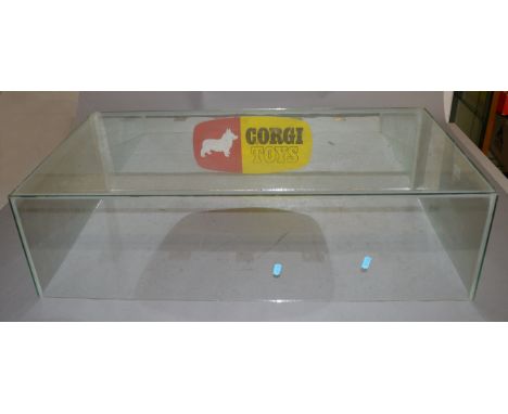 A retailers glass display cover, 85 x 44 x 23 cm approx,with mirrored back, the latter bearing a 'Corgi Toys' logo sticker.