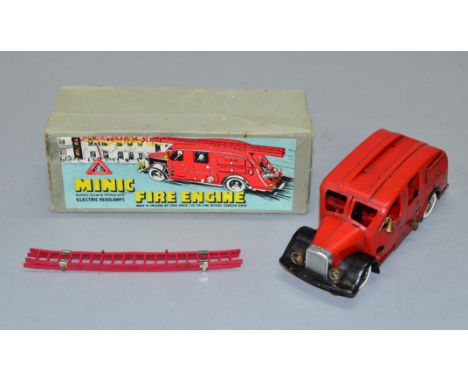 Triang Minic 62ME pre-war Fire Engine. Tinplate clockwork model with working electric lights is red with ladder and bell. G, 