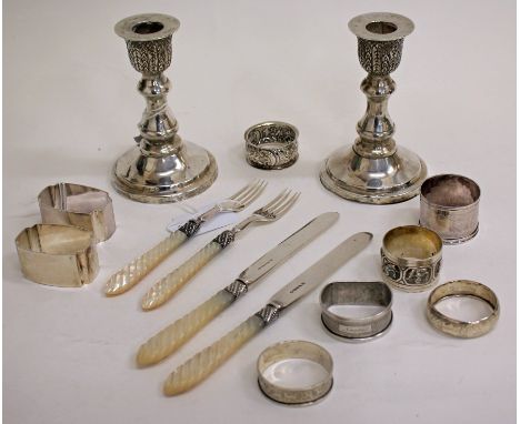 A PAIR OF THAILAND STERLING 925 SILVER CANDLESTICKS with inset piercing stick holders, each 12cm in height together with 8 si