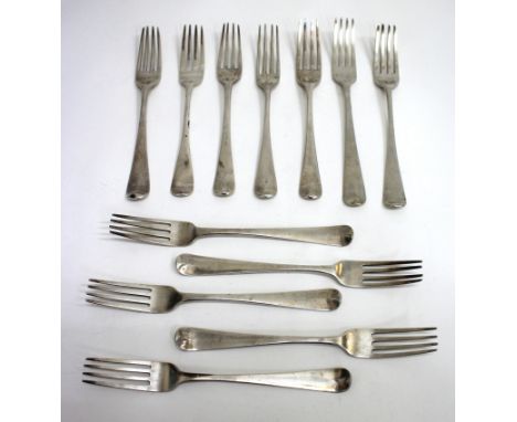 A SET OF FIVE GEORGE III IRISH SILVER OLD ENGLISH PATTERN TABLE FORKS by John Bagly Dublin 1800, an almost matching fork by a