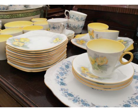 A SHELLEY PATTERN NO. 795072 PART TEA SERVICE decorated with yellow flowers, a part Colclough tea service, a Poole pottery do