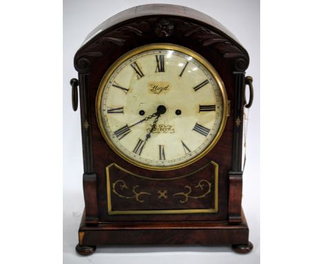 A VICTORIAN MAHOGANY CASED TABLE OR BRACKET CLOCK, the arching case with carved acanthus leaf crest above the circular dial w