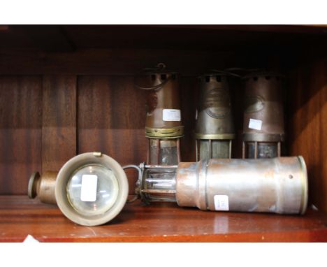 A GROUP OF FOUR VARIOUS OLD MINERS LAMPS together with an old bicycle lamp (5)