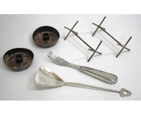 A PAIR OF DANISH STERLING TAPER STICKS by George Jensen 5.5cm wide, a condiment fork by George Jensen, a silver Arts & Crafts