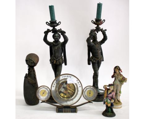 A PAIR OF COLD PAINTED SPELTER CANDLESTICKS, each in the form of a figure in medieval dress holding an urn aloft, 37cm high; 