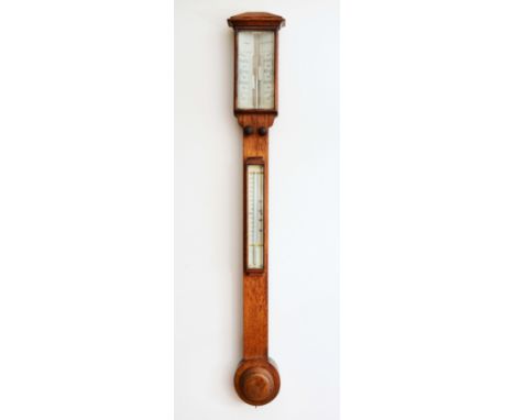 A VICTORIAN OAK STICK BAROMETER, the twin ivory vernier scales signed Mann, Gloucester, over a mercury tube thermometer, the 