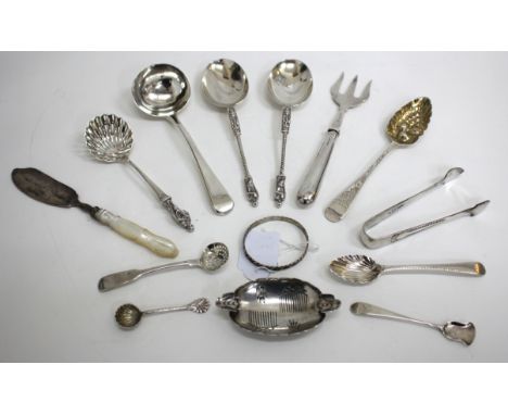 A PAIR OF VICTORIAN SILVER SERVING SPOONS the twist handles with figural terminals, 1882, a George III silver dessert spoon, 