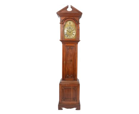 AN EARLY 20TH CENTURY OAK LONGCASE CLOCK the 12" brass break arch dial with silvered Roman chapter ring, Arabic five minutes 