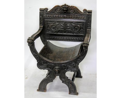 AN EARLY 20TH CENTURY JACOBEAN STYLE OAK PANEL BACK CHAIR with extensive carved decoration and lions mask decoration, 68cm wi