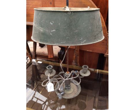 A NAPOLEAN III SILVER PLATED TABLE LAMP with a toleware shade and twin branch sconces 22cm wide 