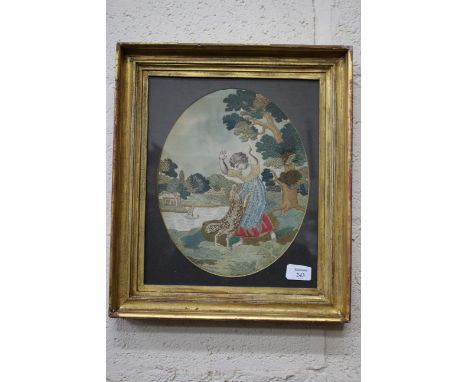 A 19TH CENTURY SILKWORK OVAL PICTURE of a child playing with a dog on a river bank 29cm x 23cm within a gilt moulded frame