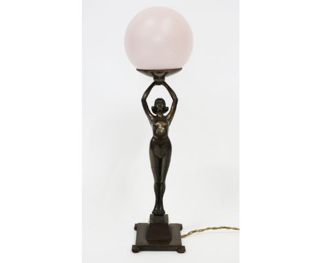 AN ART DECO BRONZED METAL FIGURAL TABLE LAMP of female form 52cm in height (shade lacking)
