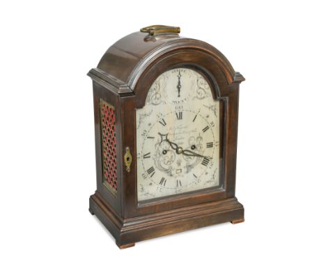 the break arch case with folding handle and rectangular brass scale fret side panels, the silvered scroll engraved 7inch dial