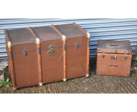 A large leather and wooden bound travelling trunk, inscribed 'A.V, N.Y' to the side, width 100cm, together with a smaller W. 