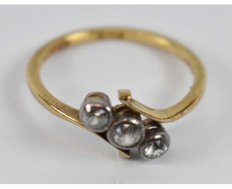 An 18ct yellow gold three stone ring, size K, approx. 2.25g.