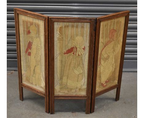 An Edwardian three leaf folding firescreen with glazed tapestry panels, each leaf 74.5 x 29.5cm.