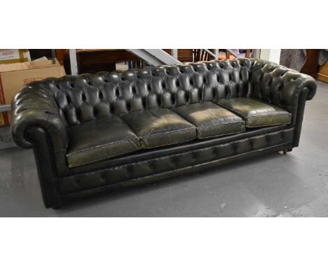 A large green leather button upholstered four seater Chesterfield sofa, width approx. 240cm. 