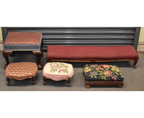 A group of five footstools, one with claw and ball feet, three with tapestry cushion covers etc. (5). 
