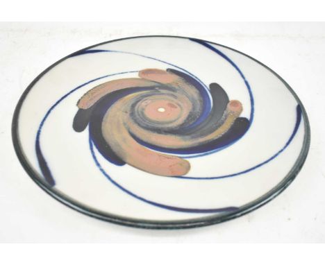 ARABIA; a Scandinavian ceramic charger with stylised decoration, diameter 29.5cm. 