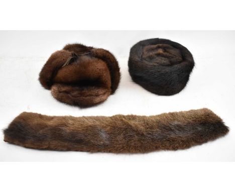 A Herbert Johnson fur hat, another by Wigéns and a small fur scarf (3). 