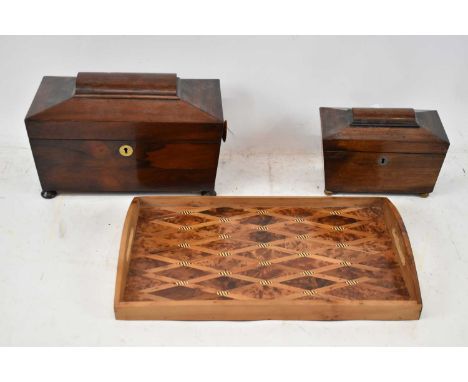 A 19th century rosewood sarcophagus form tea caddy, width 30cm, a smaller example (af) and a modern inlaid rectangular tray (