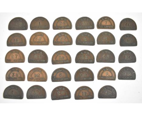 A group of approximately twenty five GWR pay cheque tokens.