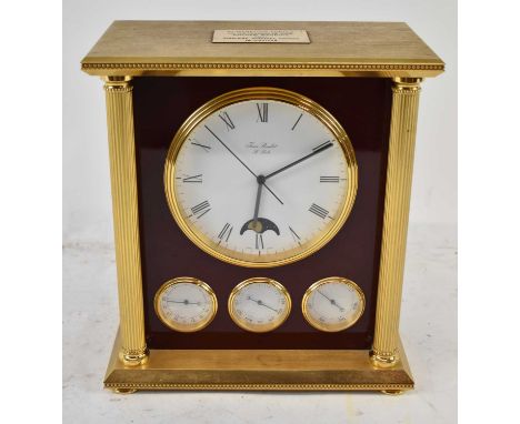 FRAN ROULET; a contemporary brass cased mantel clock with circular dial set with Roman numerals, moon phase and three subsida