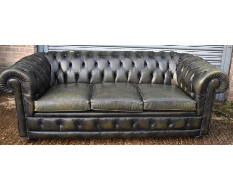 A green leather button upholstered three seater Chesterfield sofa, width approx. 205cm. 