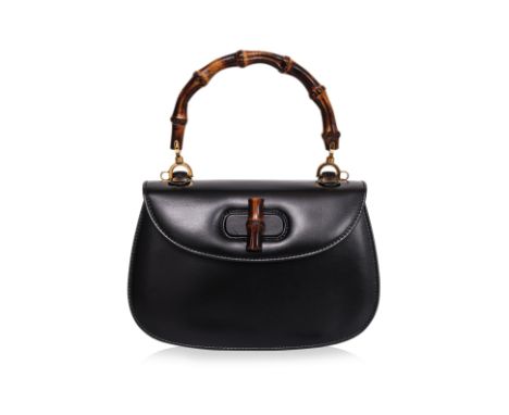 A GUCCI MEDIUM BAMBOO TOP HANDLE BAG
Black leather with curved flap closure, bamboo turn-lock clasp,  gold-tone hardware, det