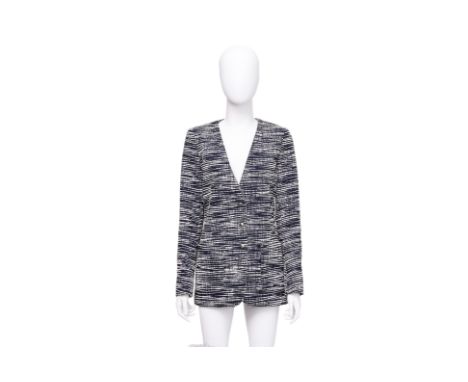 A LOUIS VUITTON TWEED COLLARLESS BLAZER BY NICOLAS GHESQUIÈRE
Featuring an abstract navy and white horizontal strié pattern, 