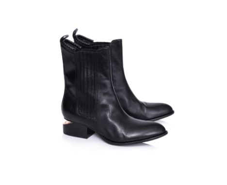A PAIR OF ALEXANDER WANG ANOUCK BOOTS
Black leather with elastic side panels, pull-tab at heel, pointed toe, and sculptural c