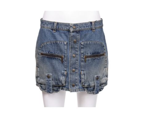 A SAINT LAURENT CARGO DENIM SKIRT BY HEDI SLIMANE
Detailed with oversized flap pockets featuring zip closures, finished with 