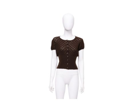 A CHRISTIAN DIOR BROWN KNIT TOP BY JOHN GALLIANO
Diamond-patterned knit with a fitted waist and puff sleeves, scalloped hem, 