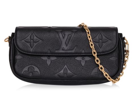 A LOUIS VUITTON WALLET ON CHAIN IVY
Black Monogram Empreinte leather with tonal embossed LV Monogram pattern, flap closure wi