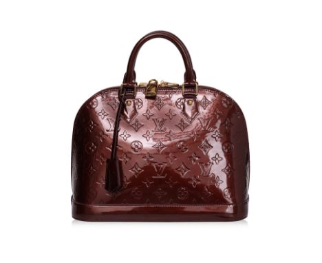 A LOUIS VUITTON VERNIS ALMA MM BAG
Vernis Monogram patent leather with dual top handles, gold-tone hardware, top zipper closu
