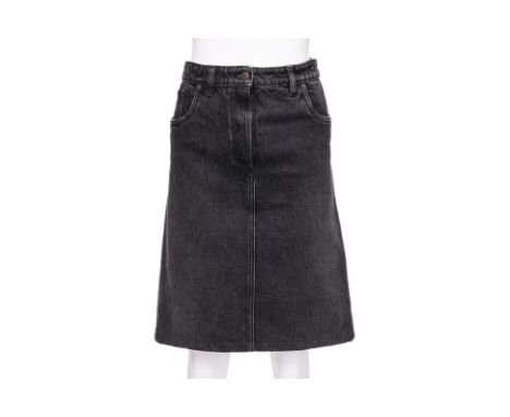 A PRADA BLACK DENIM SKIRT BY RAF SIMONS
Washed black denim with enameled Prada logo plaque to the rear pocket
Size 44
Ownersh