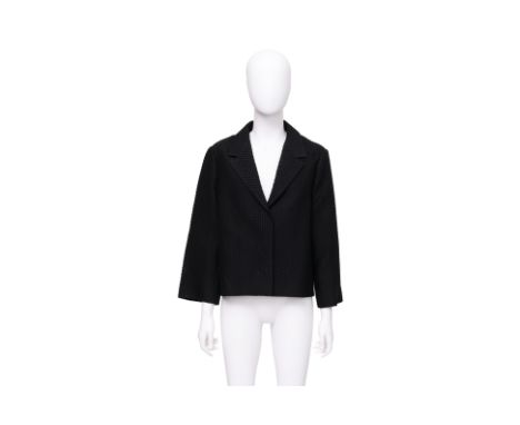 A JIL SANDER BLACK PERFORATED JACKET
With a geometric pattern, featuring a boxy cropped silhouette, notched lapels, hidden fr