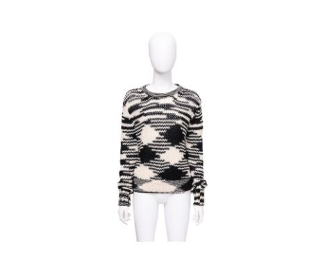 A MISSONI KNIT SWEATER
Abstract knit pattern in black and off-white, with a crew neckline, long sleeves, and ribbed cuffs and