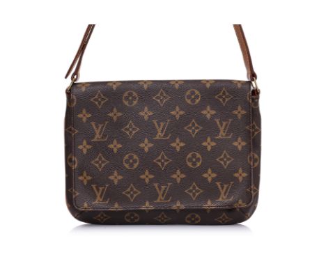 A LOUIS VUITTON MUSETTE TANGO BAG
Monogram canvas with vachetta leather trim, adjustable leather strap, flap closure with sna