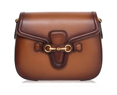 A GUCCI BROWN LEATHER MEDIUM LADY WEB SHOULDER BAG
Stained calfskin leather, featuring a front flap with horsebit hardware cl
