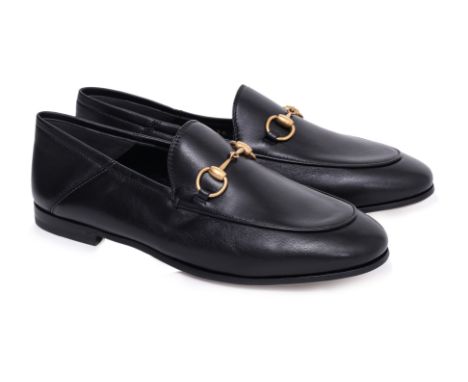 A PAIR OF GUCCI HORSEBIT COLLAPSIBLE LOAFERS
Black leather upper, gold-tone signature horsebit detail, almond toe silhouette,