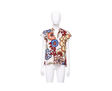A LOUIS VUITTON FLORAL PRINT BLOUSE BY NICOLAS GHESQUIÈRE
Oversized floral print, designed with a split neckline and flutter 